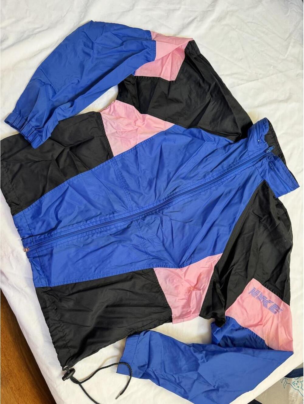 Vintage Nike windbreaker jacket with blue, black, and pink color blocking